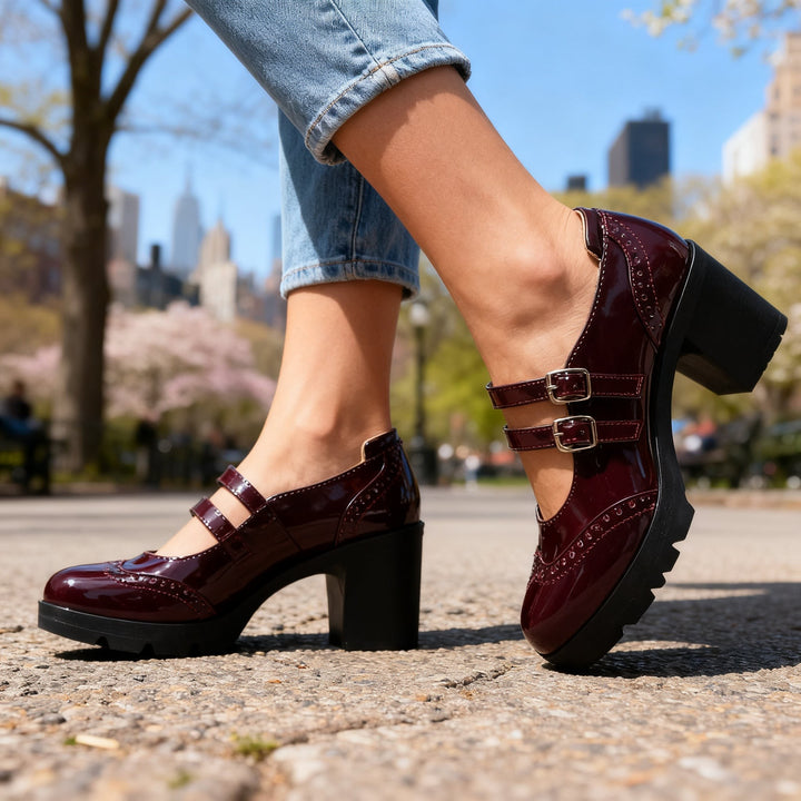 Burgundy patent Mary Jane heels featuring buckle straps and chunky platform