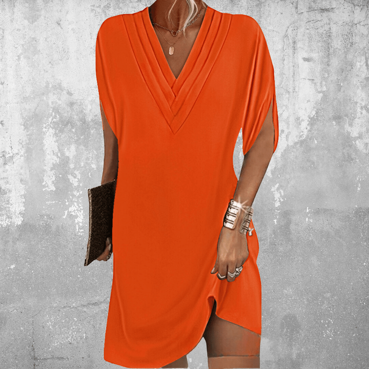 Orange V-neck tunic dress featuring flowy batwing sleeves and side slit