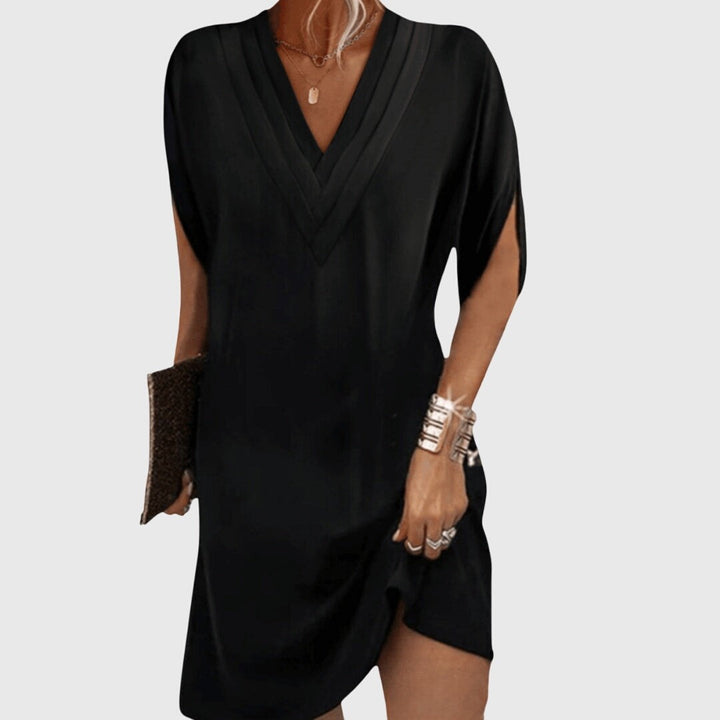 black V-neck tunic dress with split sleeves and slit hem
