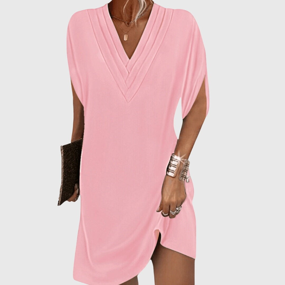 pink V-neck tunic dress featuring split cap sleeves and side slit