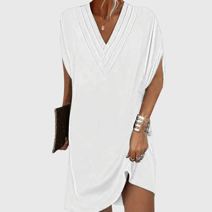 white V-neck tunic dress with pleated neckline and split sleeves