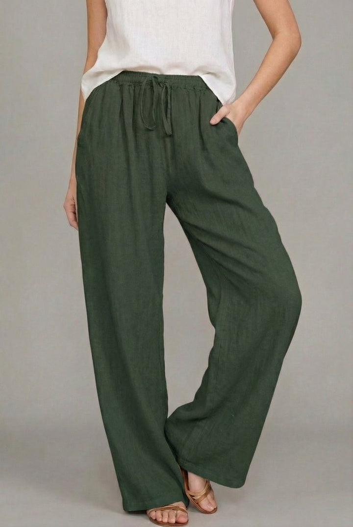 Olive green linen drawstring pants featuring relaxed wide leg fit