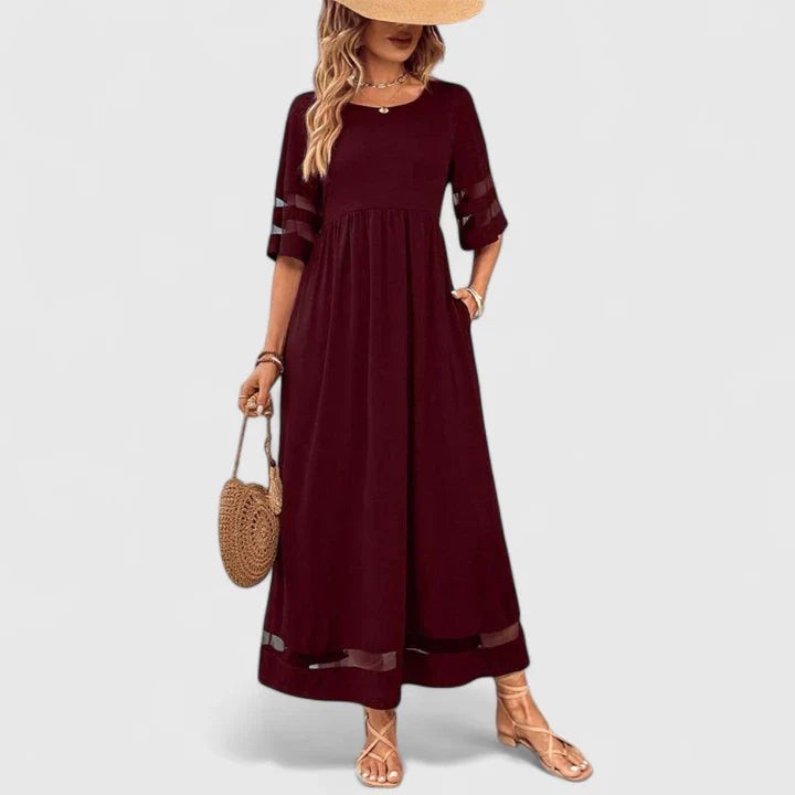 Burgundy maxi dress with mesh sleeve panels and flowy A-line skirt