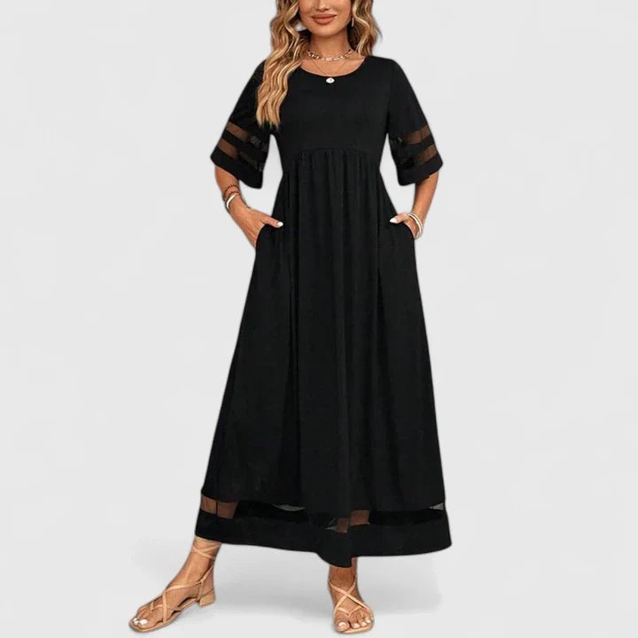 Black flowy midi dress with mesh panel sleeves and pockets