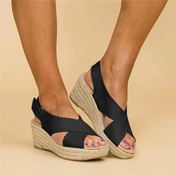 Black espadrille wedge sandals with ankle strap and crisscross front design