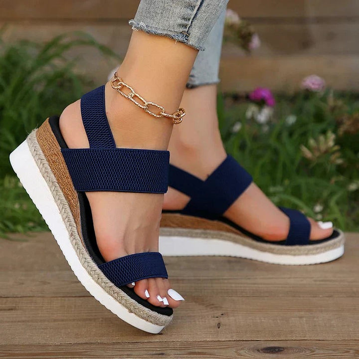 Navy blue elastic strap wedge sandal with cork-style platform base