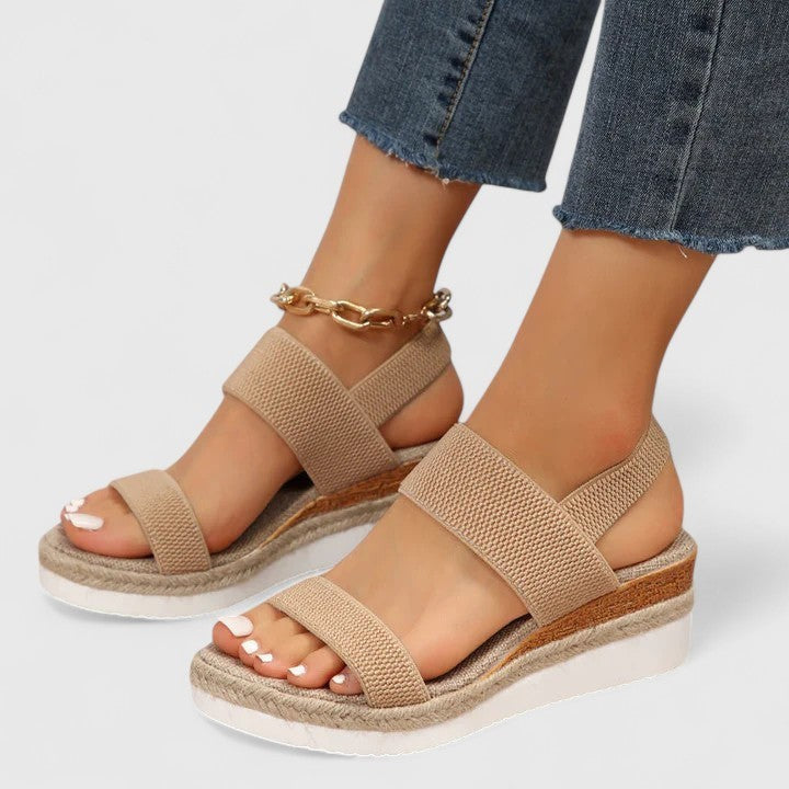 beige wedge sandals with elastic ankle strap and espadrille sole