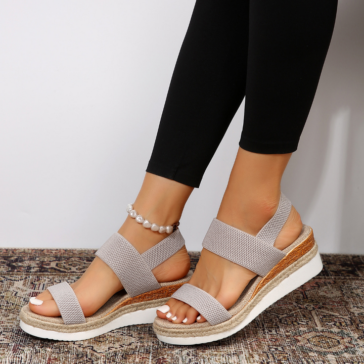 Gray woven strap wedge sandal with espadrille sole and pearl anklet
