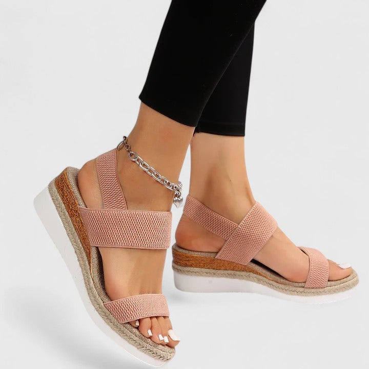 blush pink wedge sandals with elastic straps and gold anklet