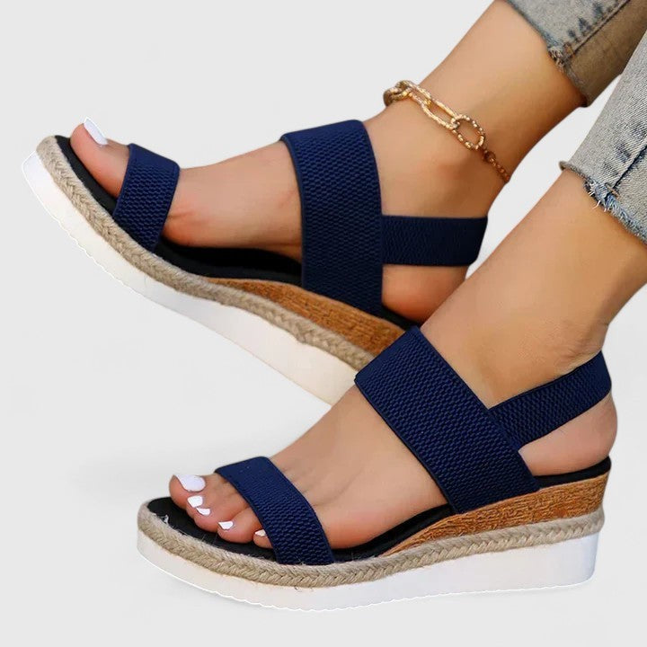 navy wedge sandals with elastic straps on woven platform sole