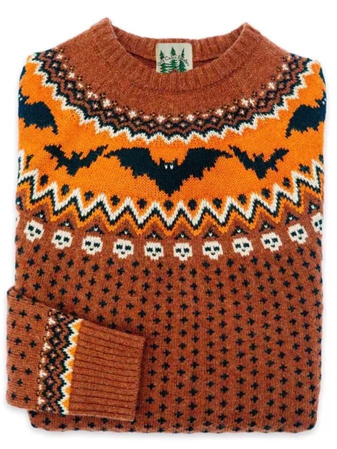 Rust orange Fair Isle sweater with knit bat and skull motif