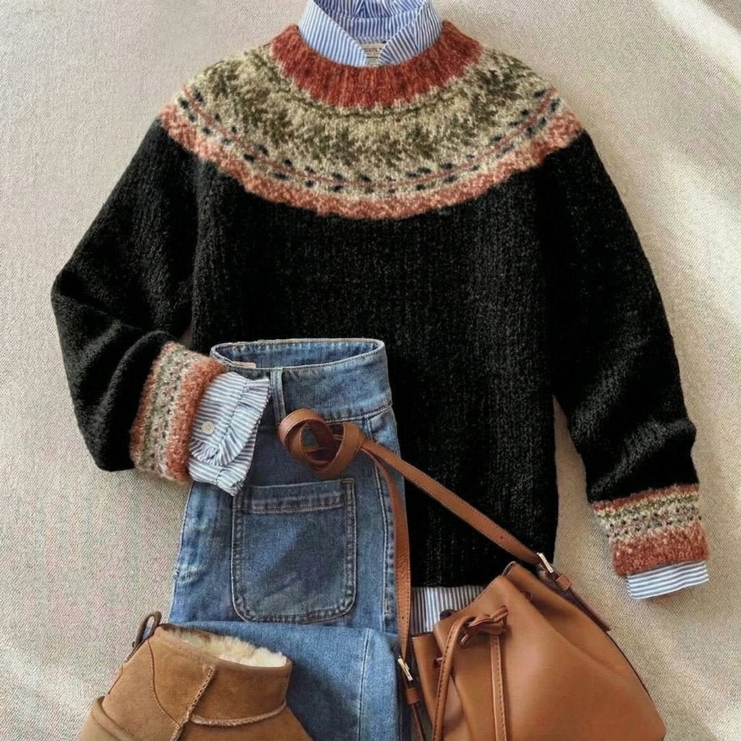 Black Fair Isle sweater featuring rust and olive patterned yoke, paired with jeans