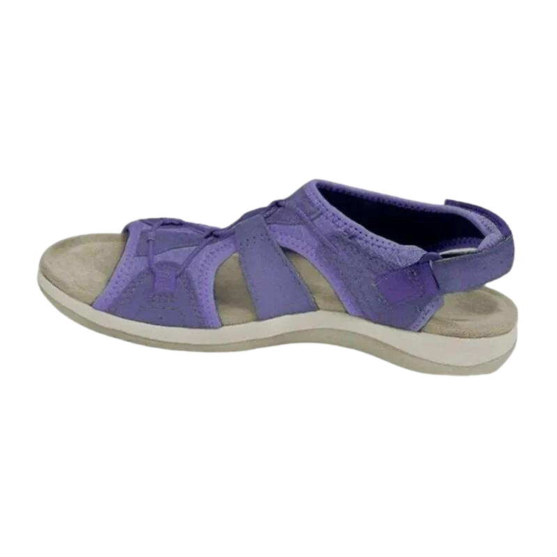 Lavender purple suede sandals with crisscross straps and white outsole