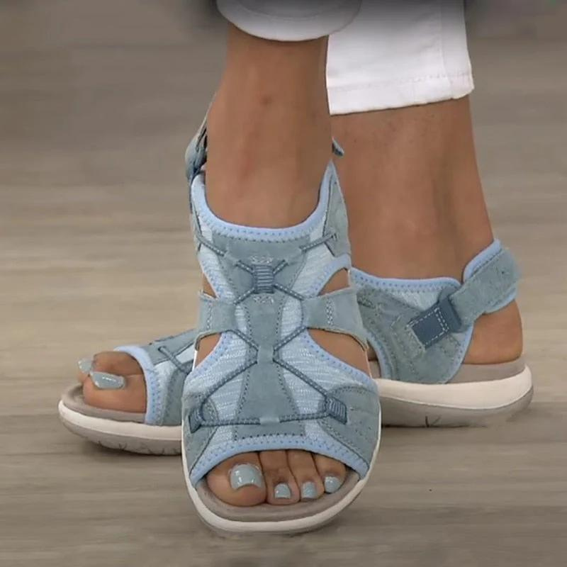 Sky blue open-toe sandals with adjustable Velcro strap and cutout sides