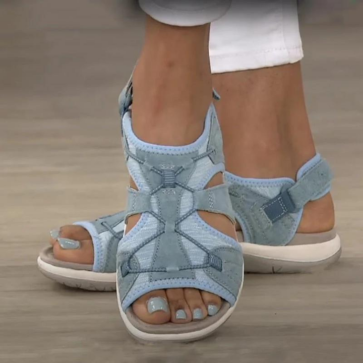 Sky blue open-toe sandals with adjustable Velcro strap and cutout sides