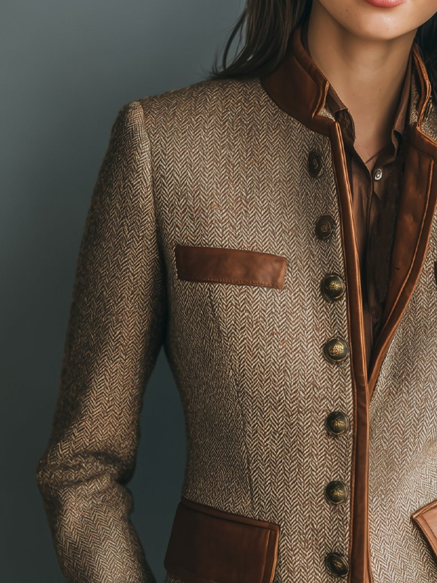Close-up of tweed blazer showing leather-trimmed collar and pocket flap