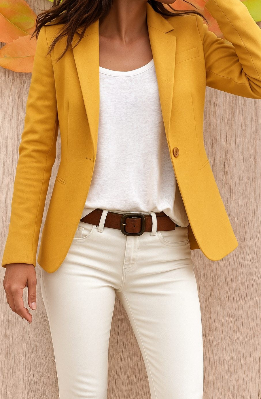 Mustard yellow tailored blazer styled with white top and cream skinny jeans