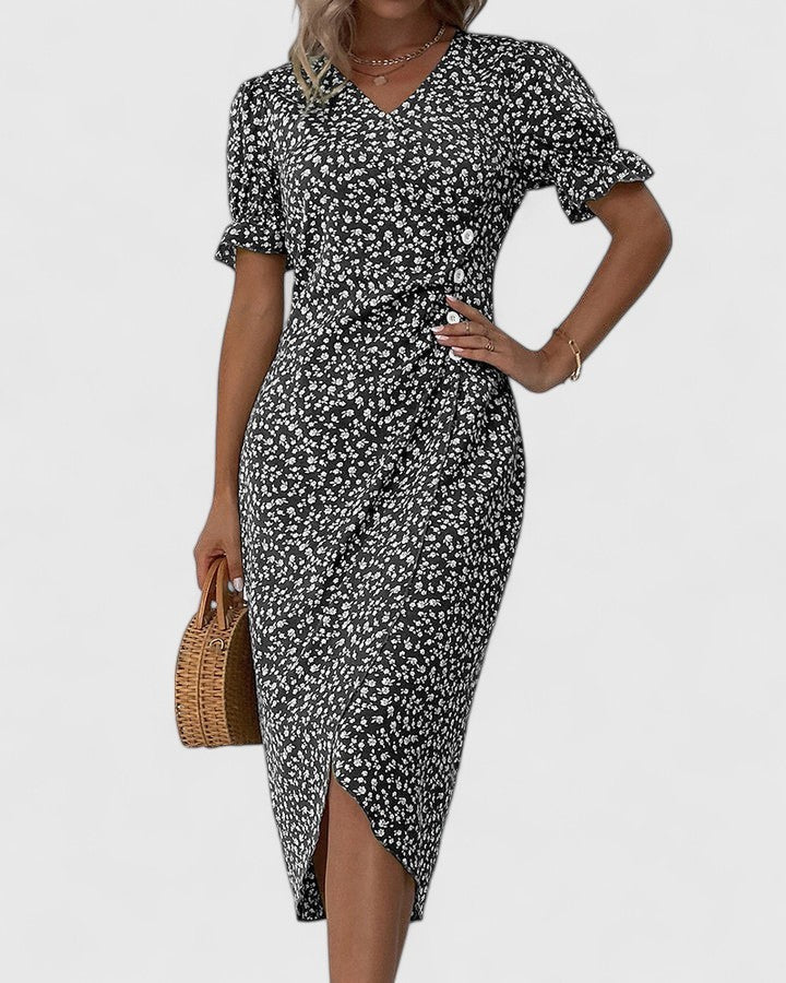 Black ditsy floral dress with tie waist and tulip hem