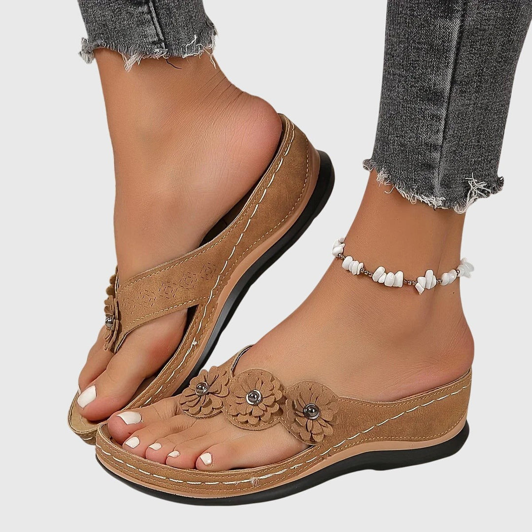 tan suede wedge flip flops with floral toe strap detail