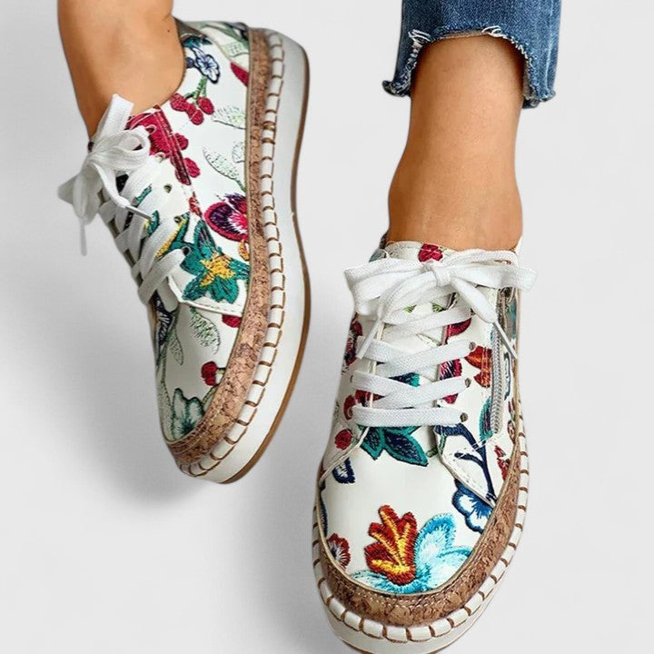 floral embroidered sneakers with side zipper worn with cropped jeans