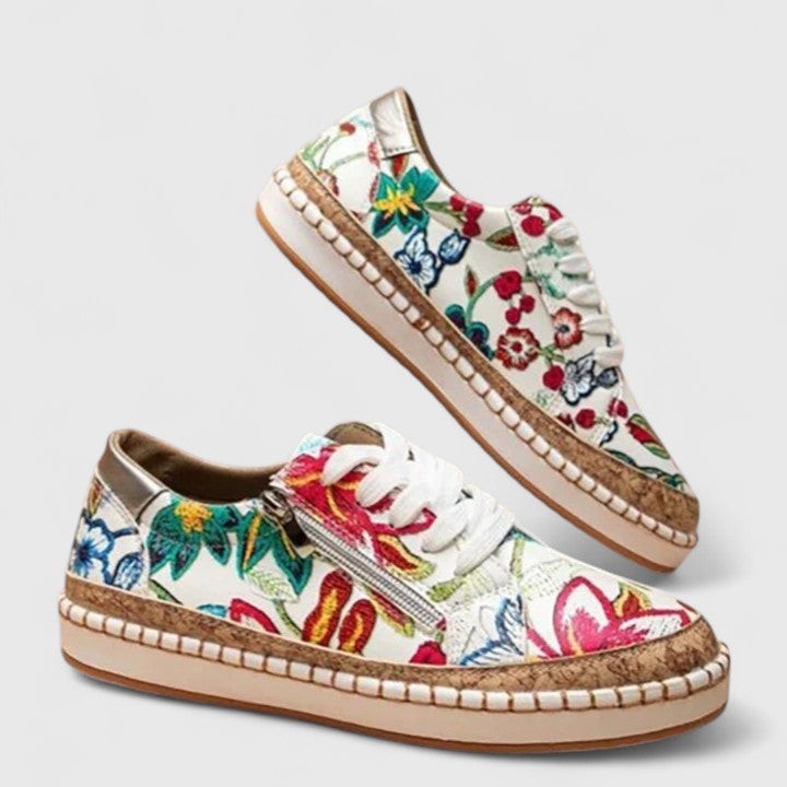 white and multicolor floral sneakers with cork trim and white laces