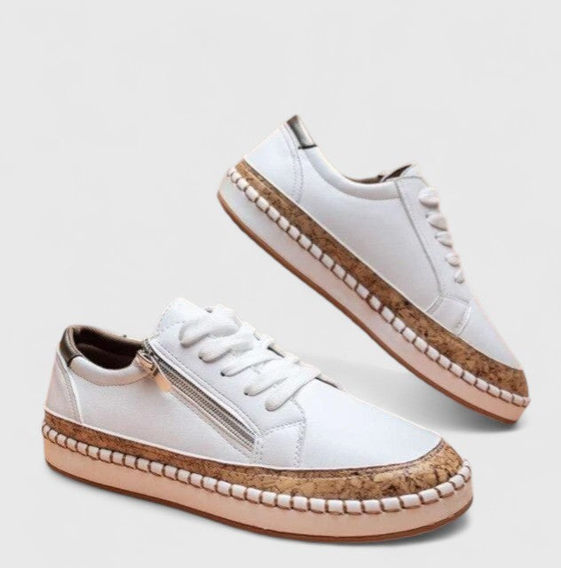 white leather sneakers with cork sole and side zip closure
