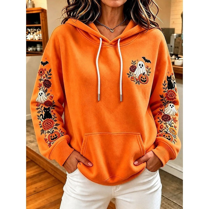 orange hoodie with embroidered ghost, pumpkin, and floral sleeve design