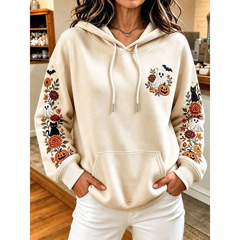 beige hoodie with floral embroidery, ghost, and pumpkin graphics on sleeves