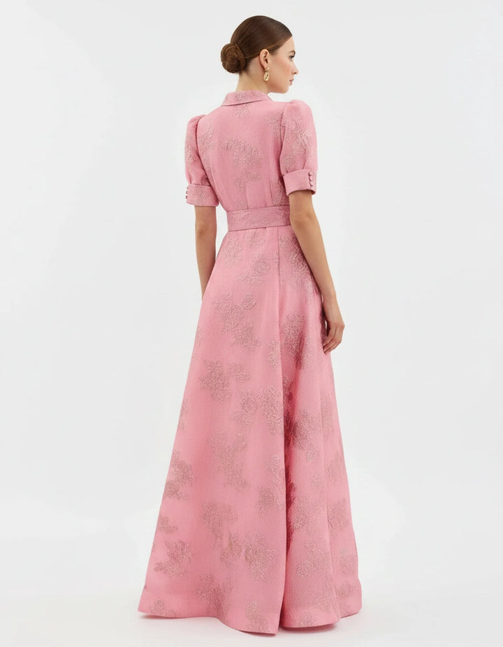 Back view of pink floral jacquard shirtdress with puff sleeves and belt