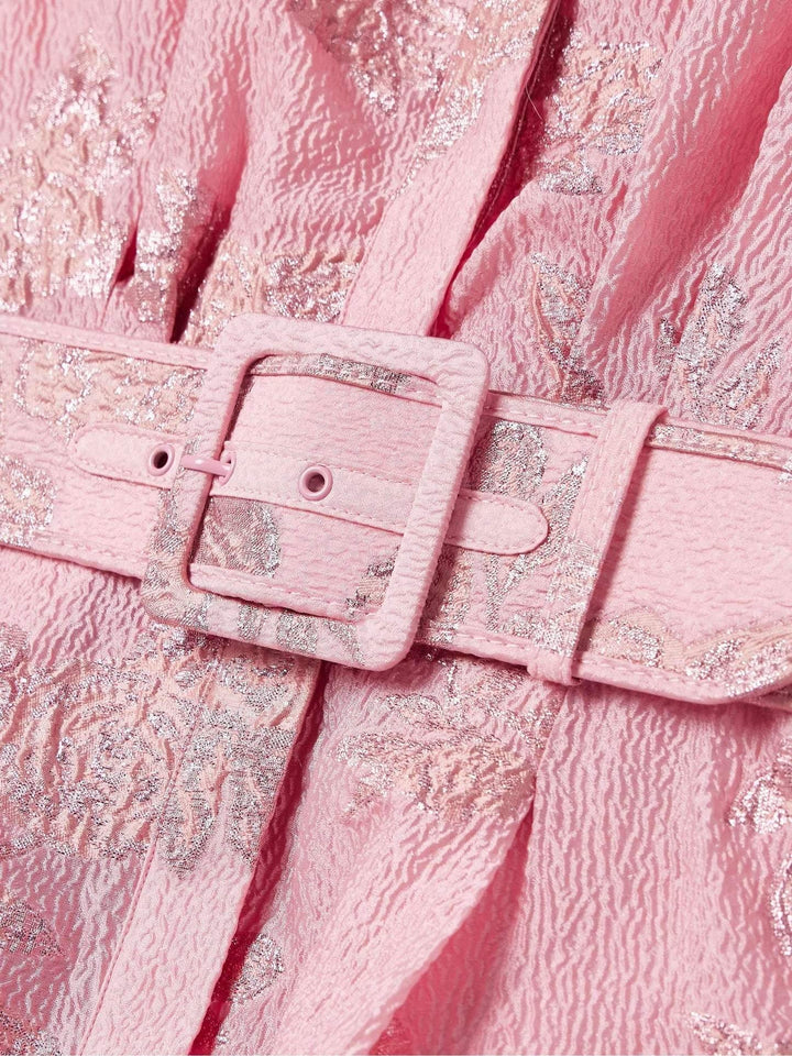 Close-up of belted buckle detail on pink metallic floral jacquard dress