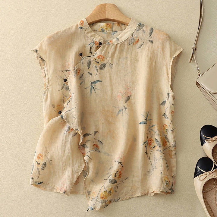 Beige floral linen blouse with mandarin collar and cap sleeves on hanger