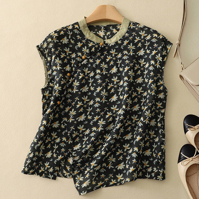 Black daisy print sleeveless top with mandarin collar and cap sleeves