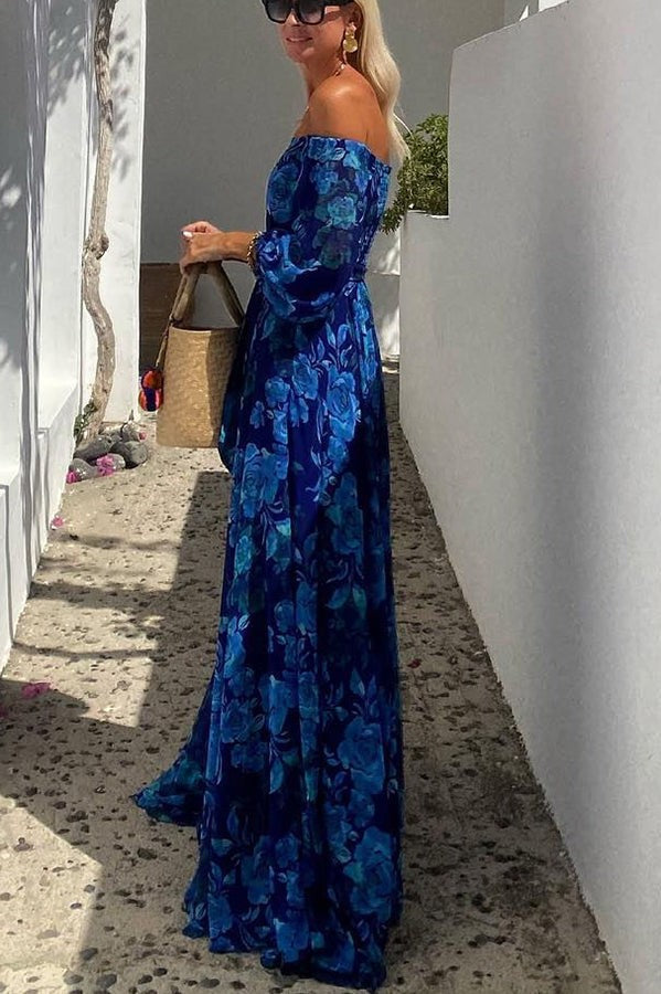 Side view of blue floral maxi dress showing flowy pleated skirt silhouette