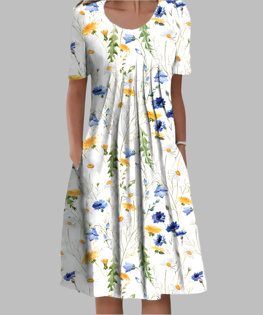 White midi dress featuring blue and yellow wildflower floral print