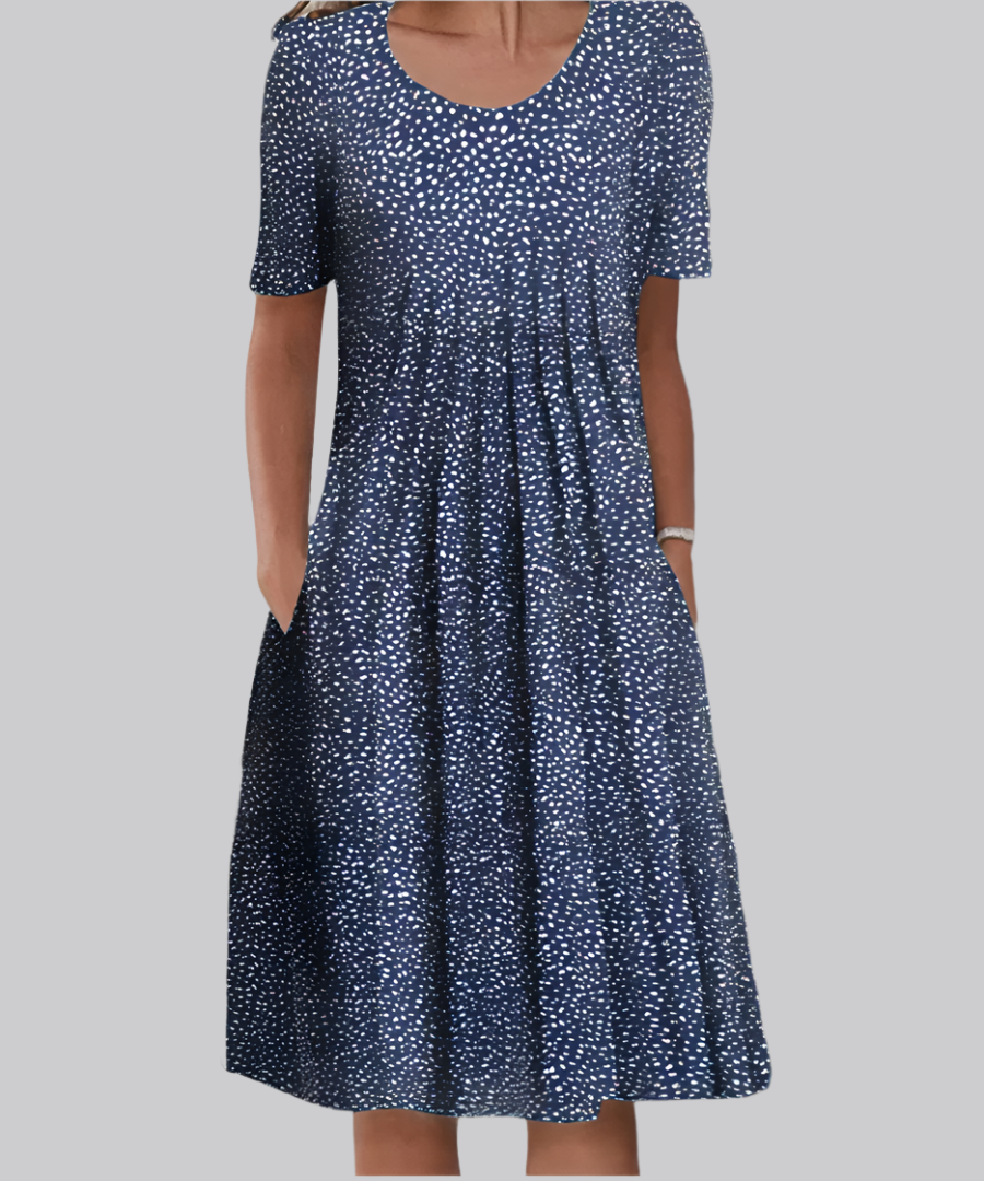 Navy blue midi dress with white speckled dot pattern and pockets