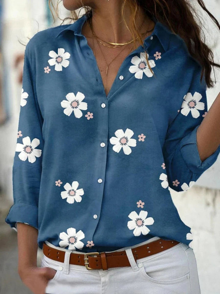 Blue floral print button-down blouse with rolled sleeves and collared neckline