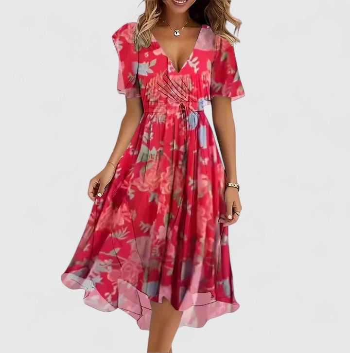 Red floral chiffon wrap dress with flutter sleeves and flowy midi skirt
