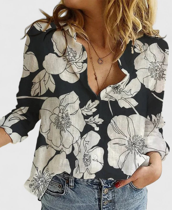 black floral print linen blouse with button-down front and long sleeves