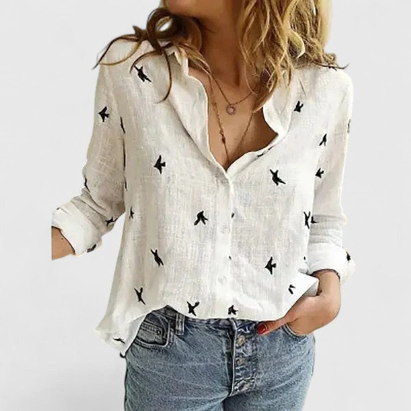 white bird print linen blouse with button-down front and long sleeves