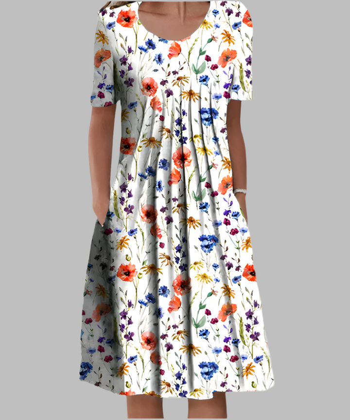 wildflower print A-line dress with short sleeves and pleated bodice