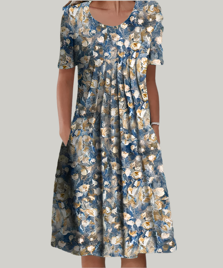 Blue floral midi dress with pleated front, short sleeves and side pockets