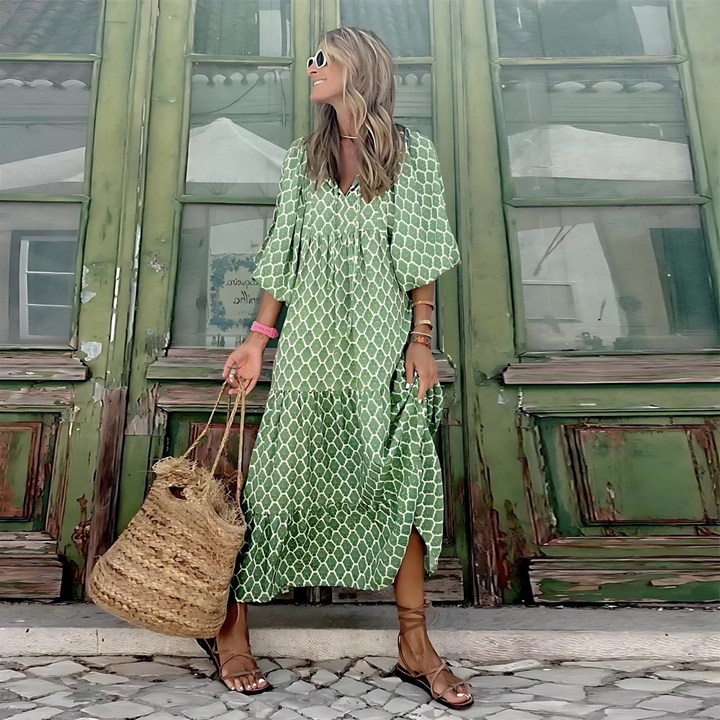 Green geometric print maxi dress with tiered skirt and flowy puff sleeves