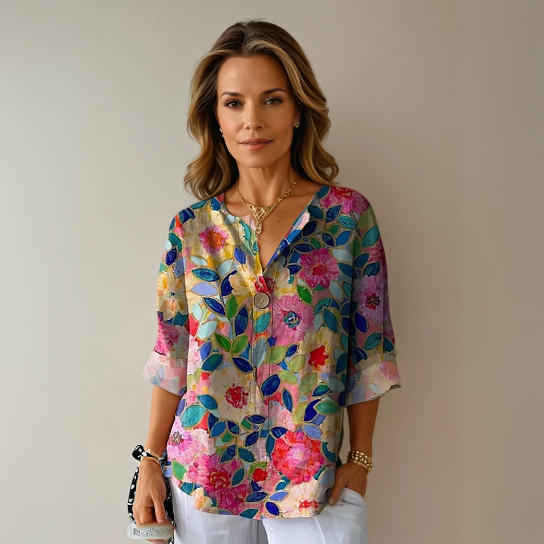 Floral print blouse with V-neck and three-quarter sleeves in pink and blue tones