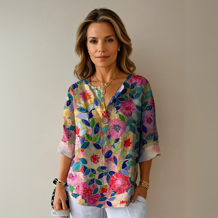Floral print blouse with V-neck and three-quarter sleeves in pink and blue tones