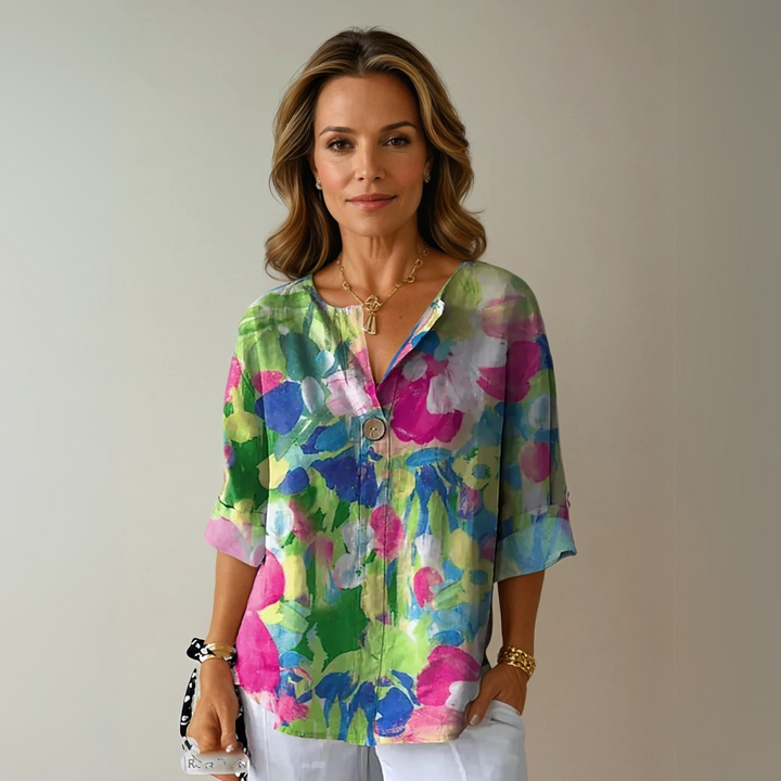 Abstract watercolor print blouse in green and pink with V-neck detail