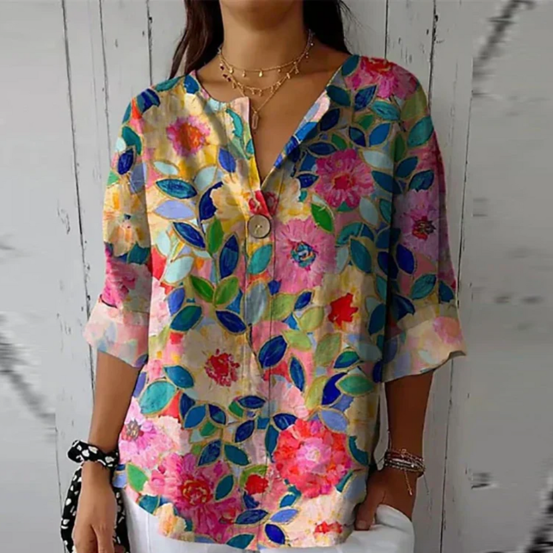 Colorful floral blouse with stained-glass leaf pattern and button front detail