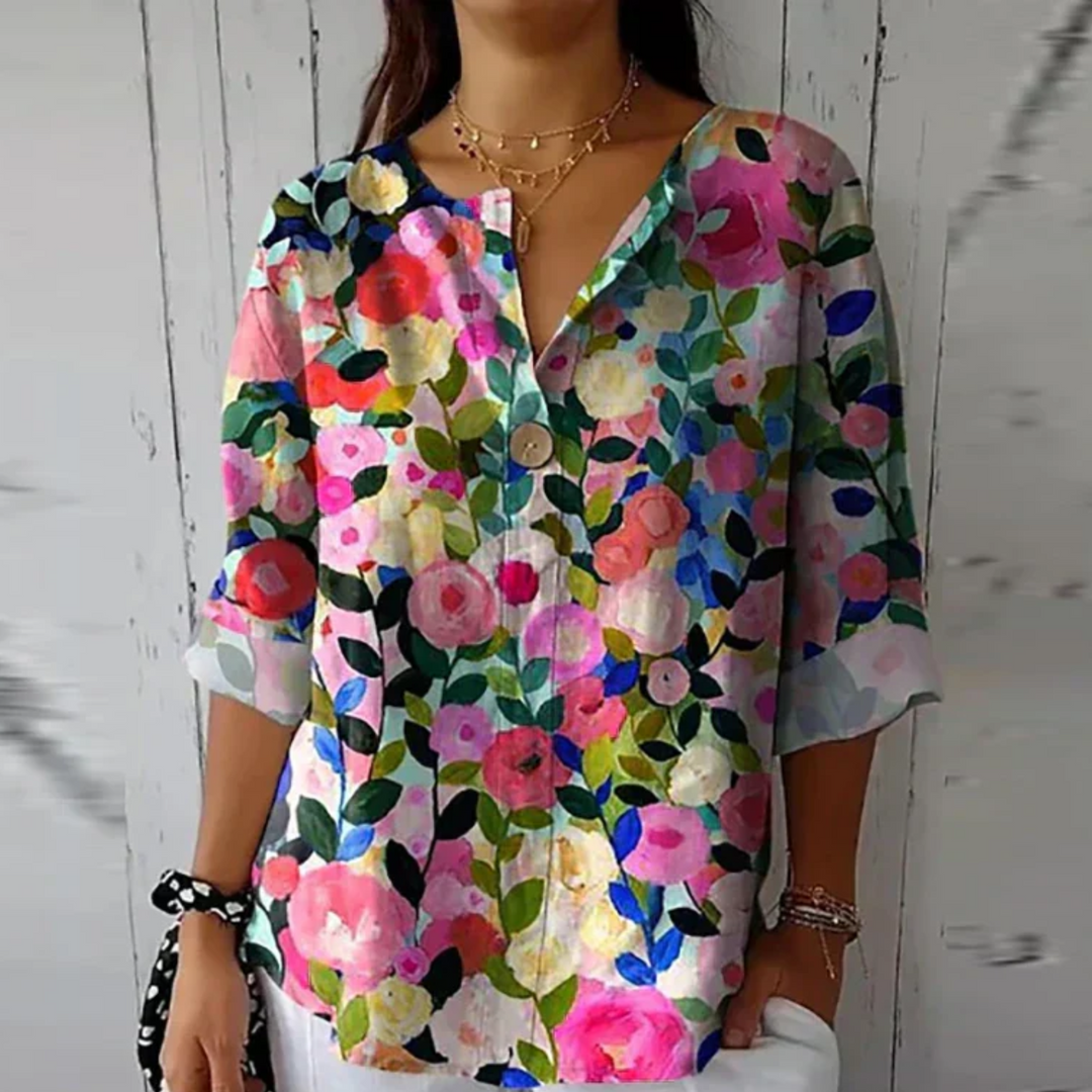 Rose garden print blouse with V-neckline and three-quarter length sleeves