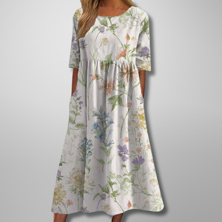 White floral midi dress with pastel wildflower print and pocket detail