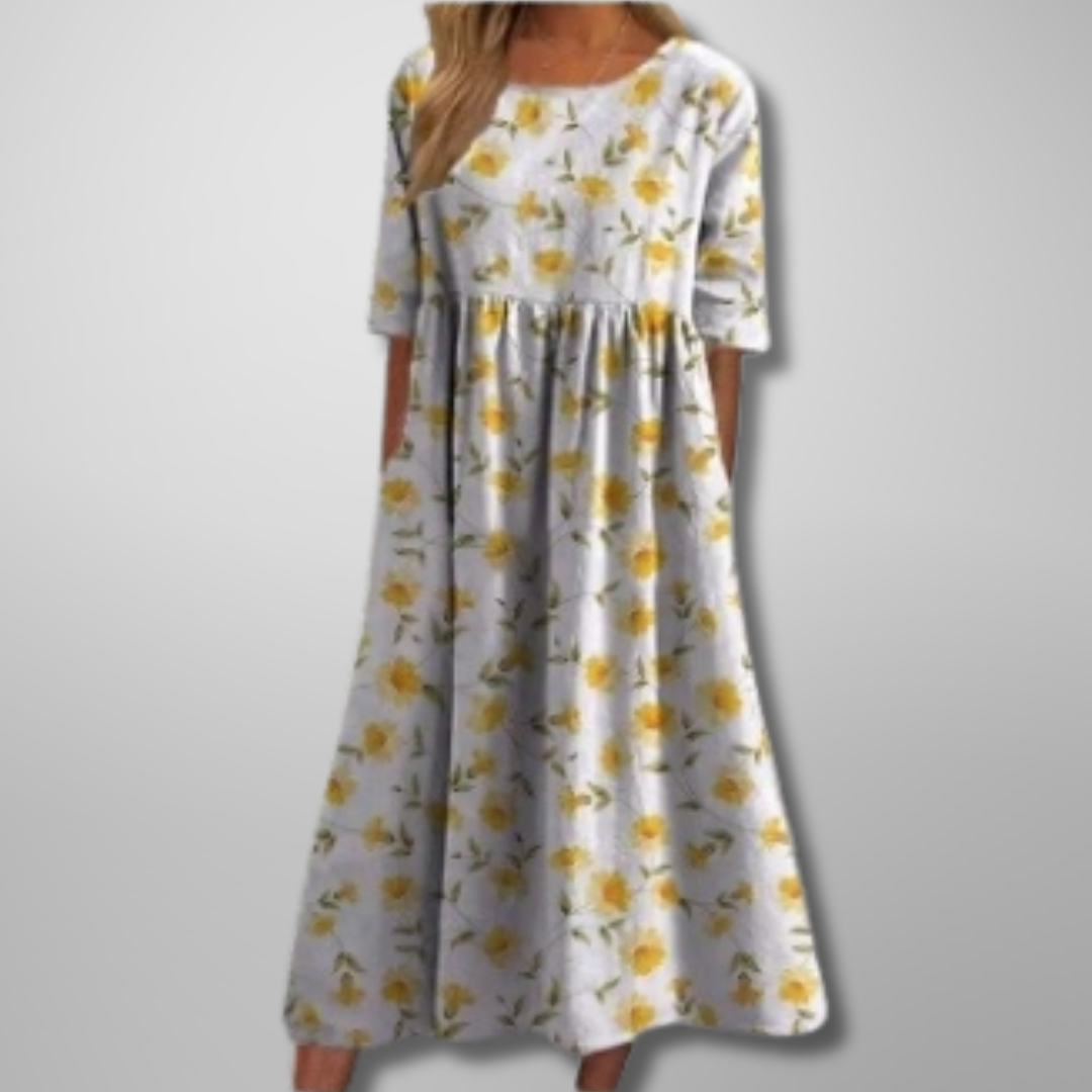 White floral midi dress with yellow blossom print and relaxed fit