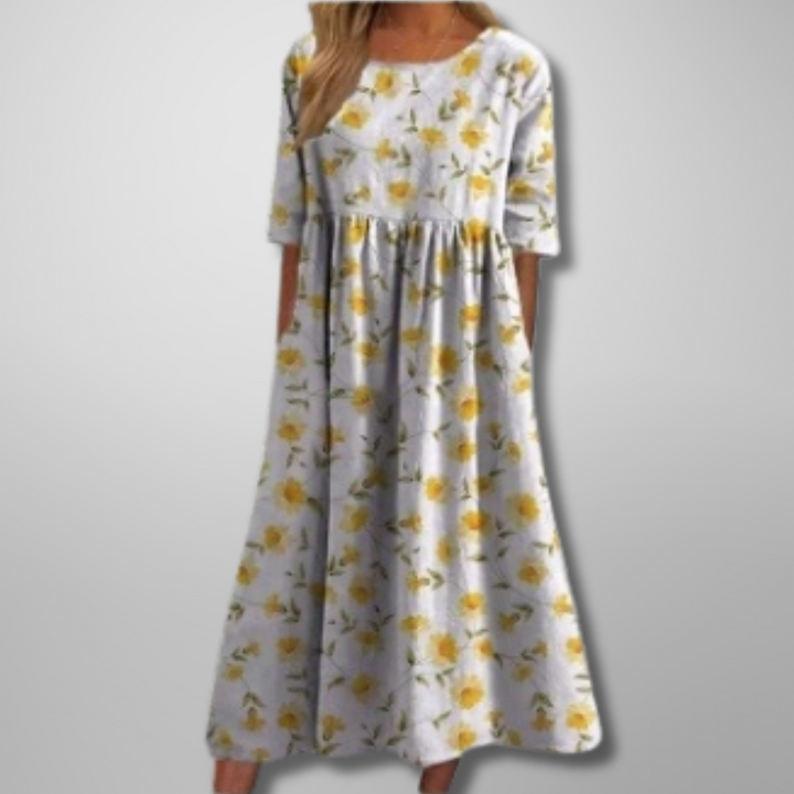 White floral midi dress with yellow blossom print and relaxed fit